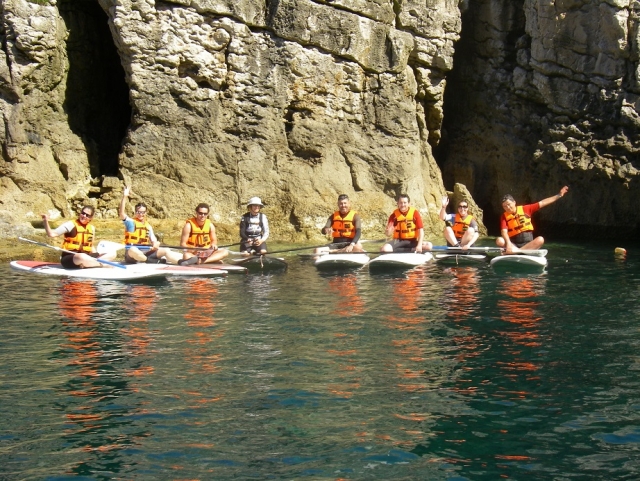  Sitting resting on the sup boards 